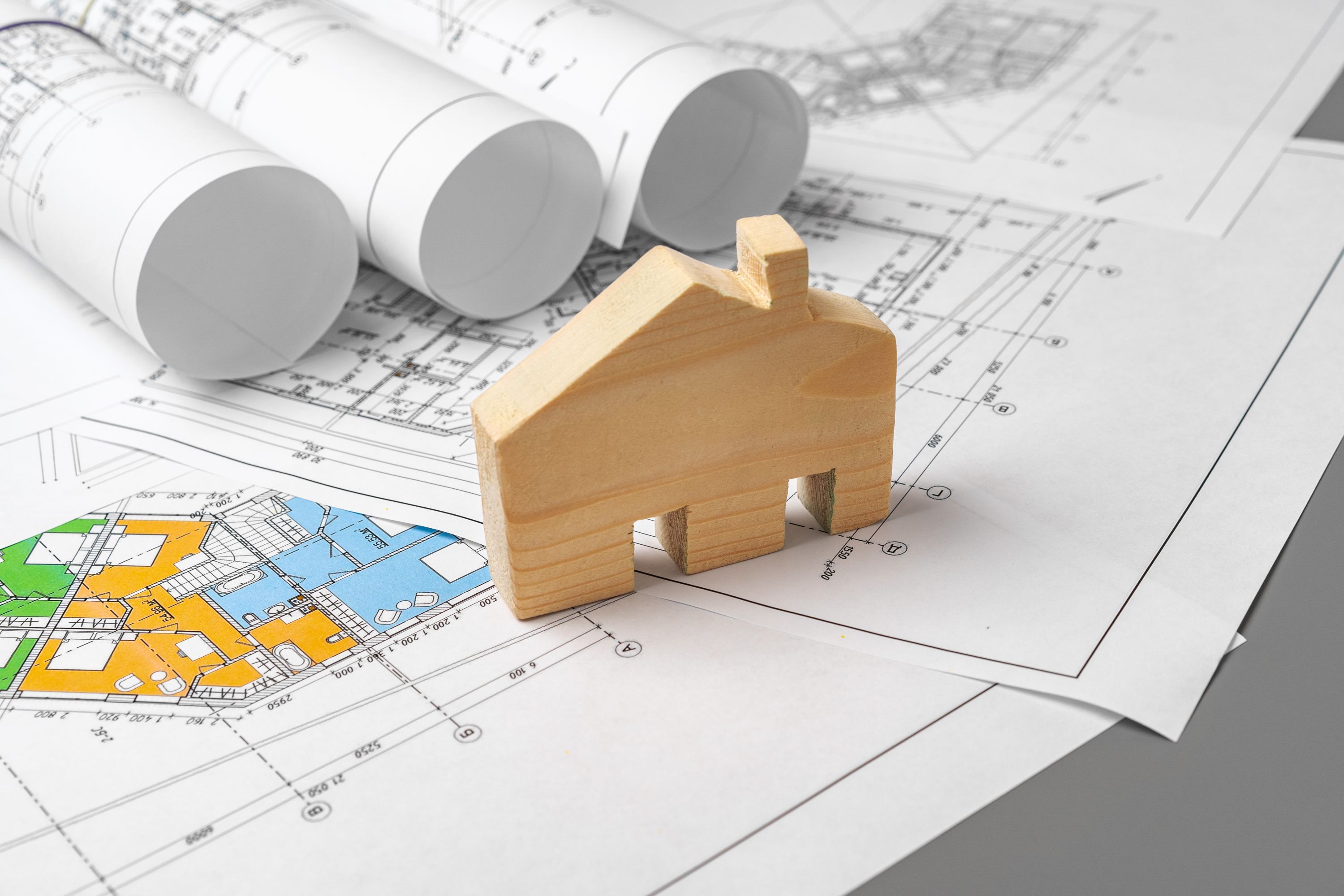 Architectural construction plans paper on table close up