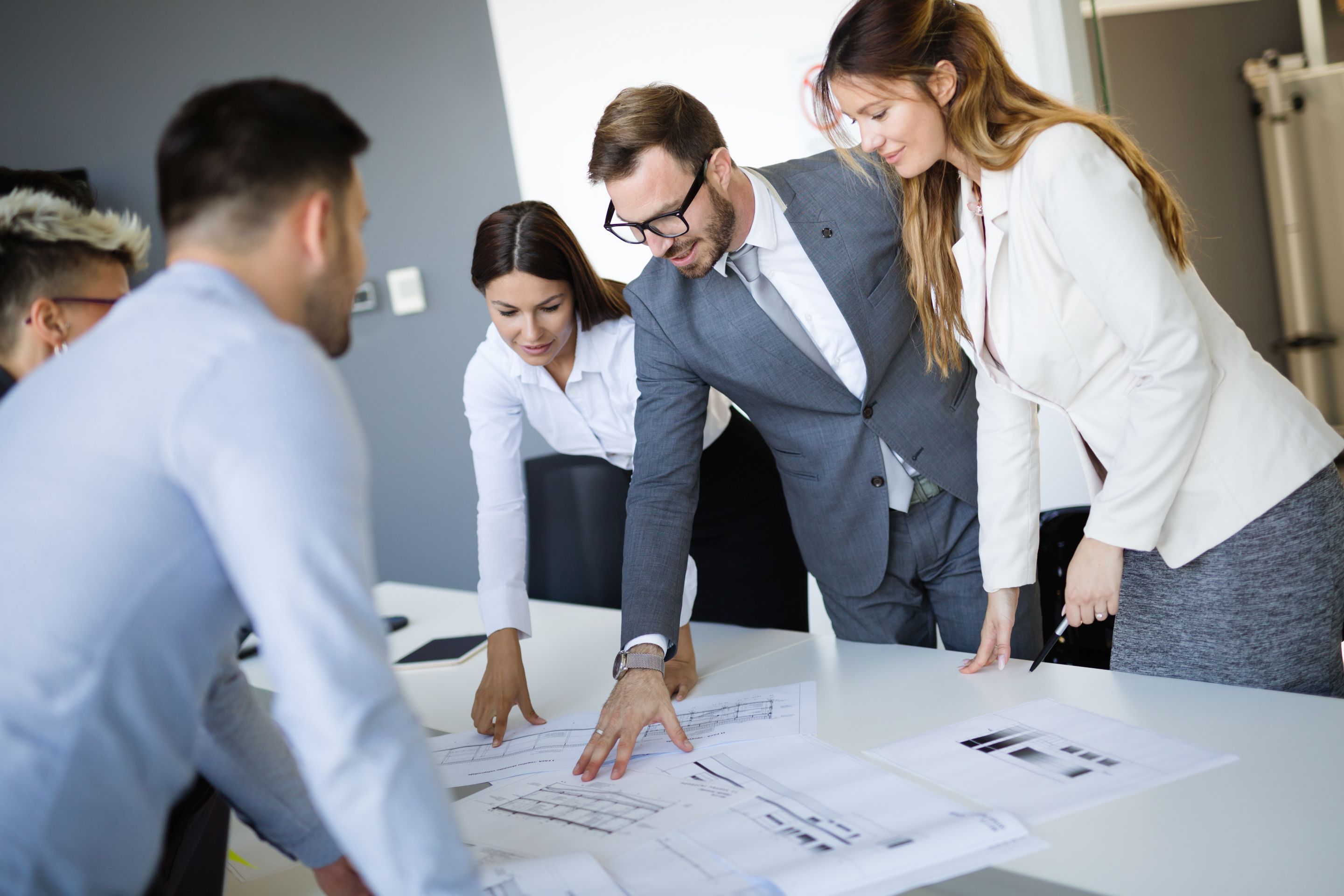 Team of architects working on construction plans