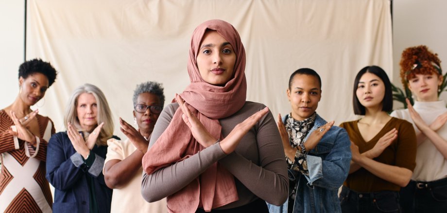 Middle Eastern woman wearing hajib gesturing Break The Bias in s