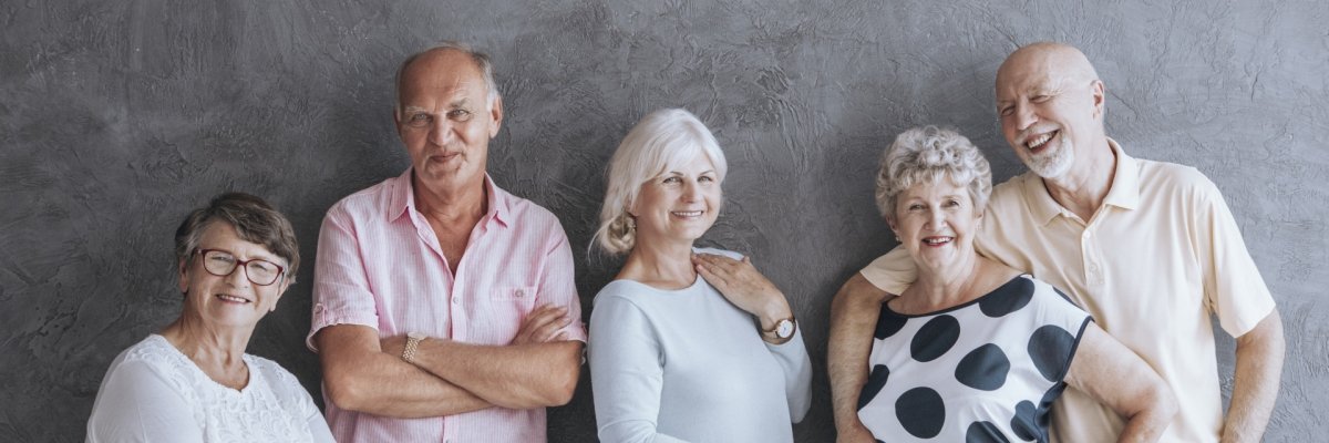 A panorama portrait of a group of happy elderly men and women in